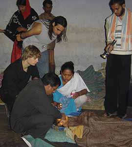 Hassan Ali and Timothy Joseph assessing FRI Eye Camp patients post-op